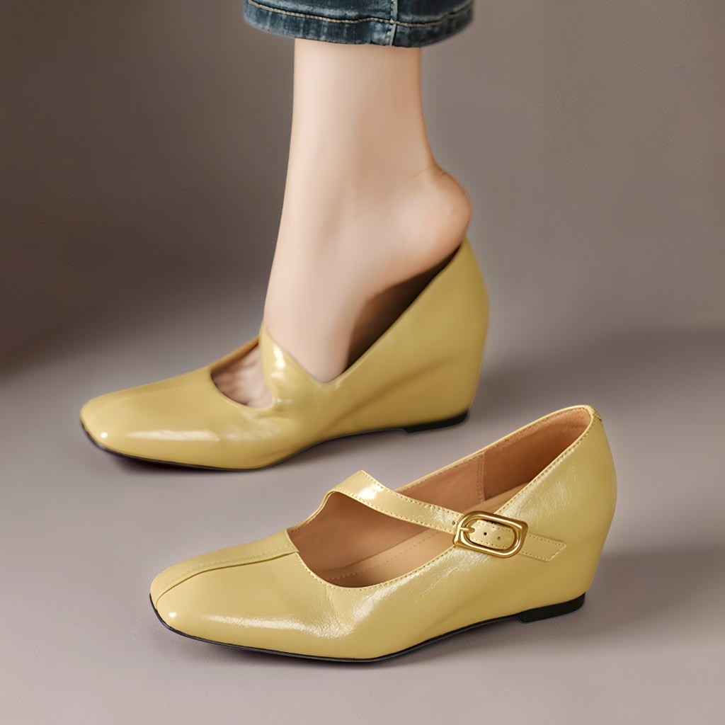 Genuine leather Mary Jane heels with a tilted buckle strap, square toe and concealed wedge sole