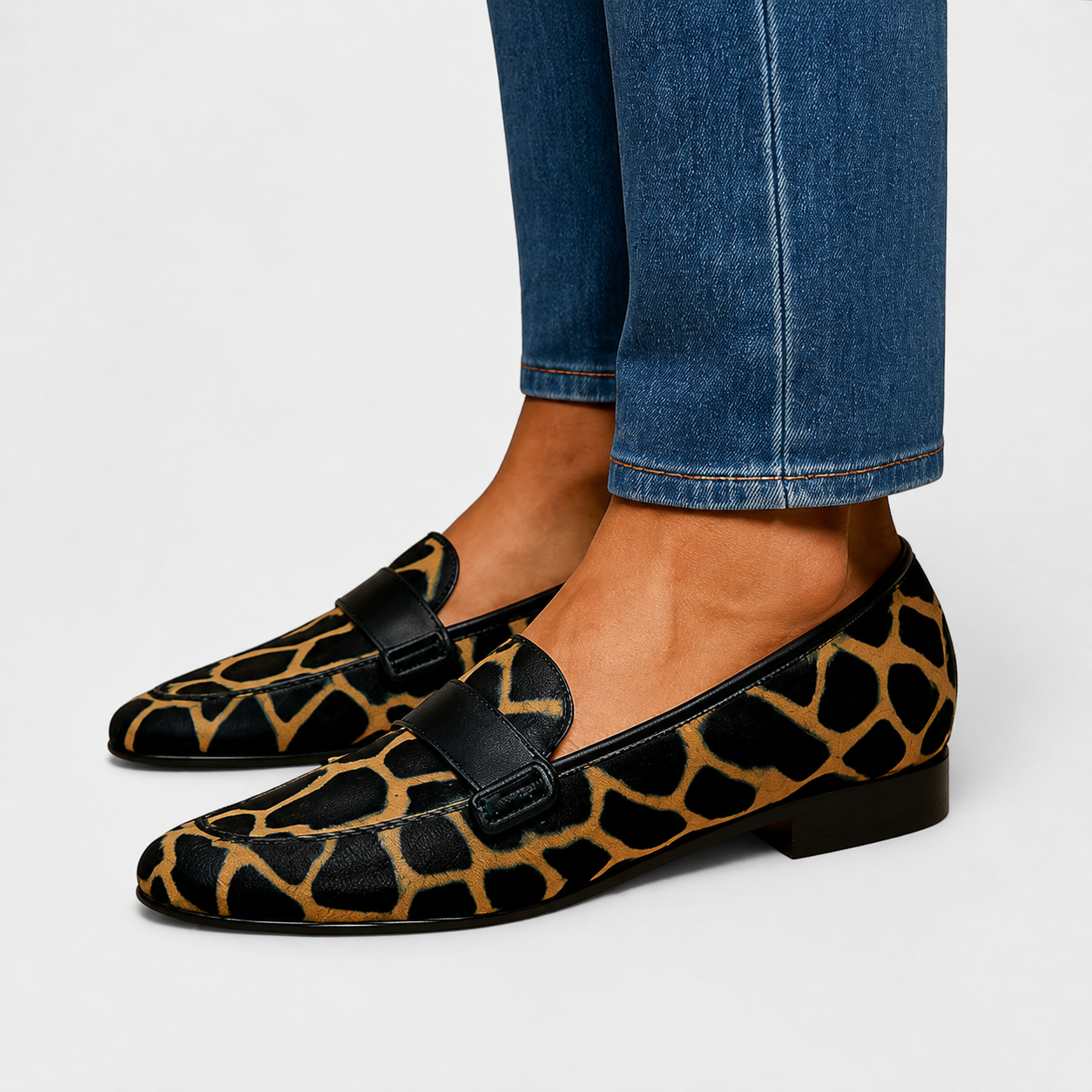 Leopard print slip-on loafers with a classic silhouette and refined finish
