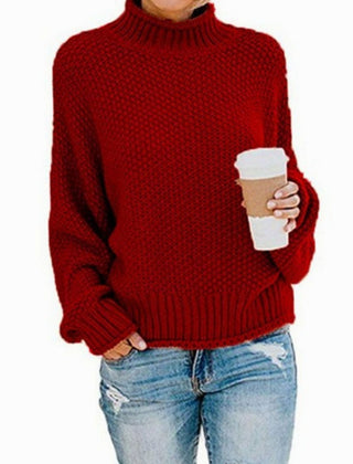 Woman wearing an oversized chunky knit turtleneck sweater with a relaxed fit and ribbed collar