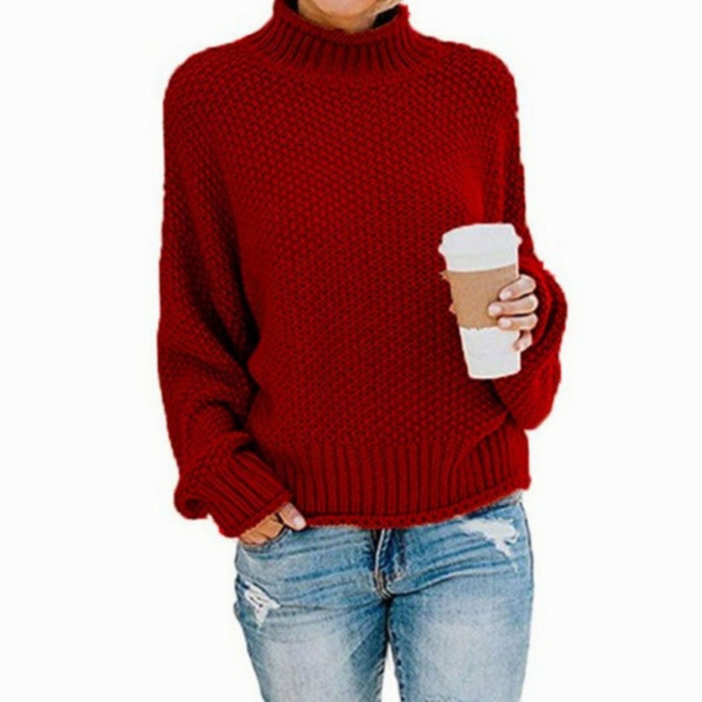Woman wearing an oversized chunky knit turtleneck sweater with a relaxed fit and ribbed collar