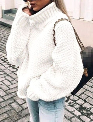 Woman wearing an oversized chunky knit turtleneck sweater with a relaxed fit and ribbed collar