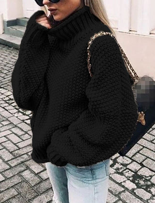 Woman wearing an oversized chunky knit turtleneck sweater with a relaxed fit and ribbed collar