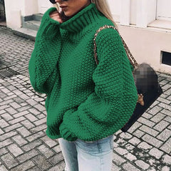 Woman wearing an oversized chunky knit turtleneck sweater with a relaxed fit and ribbed collar
