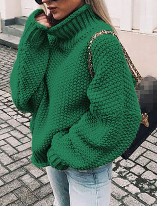 Woman wearing an oversized chunky knit turtleneck sweater with a relaxed fit and ribbed collar