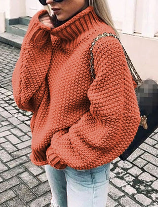 Woman wearing an oversized chunky knit turtleneck sweater with a relaxed fit and ribbed collar