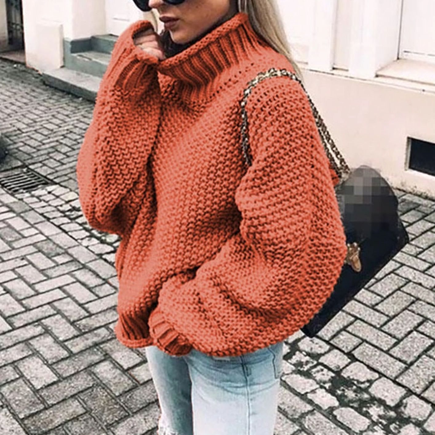 Woman wearing an oversized chunky knit turtleneck sweater with a relaxed fit and ribbed collar