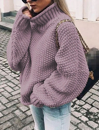 Woman wearing an oversized chunky knit turtleneck sweater with a relaxed fit and ribbed collar