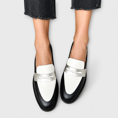 Black loafers with a subtle metallic sheen and refined detailing