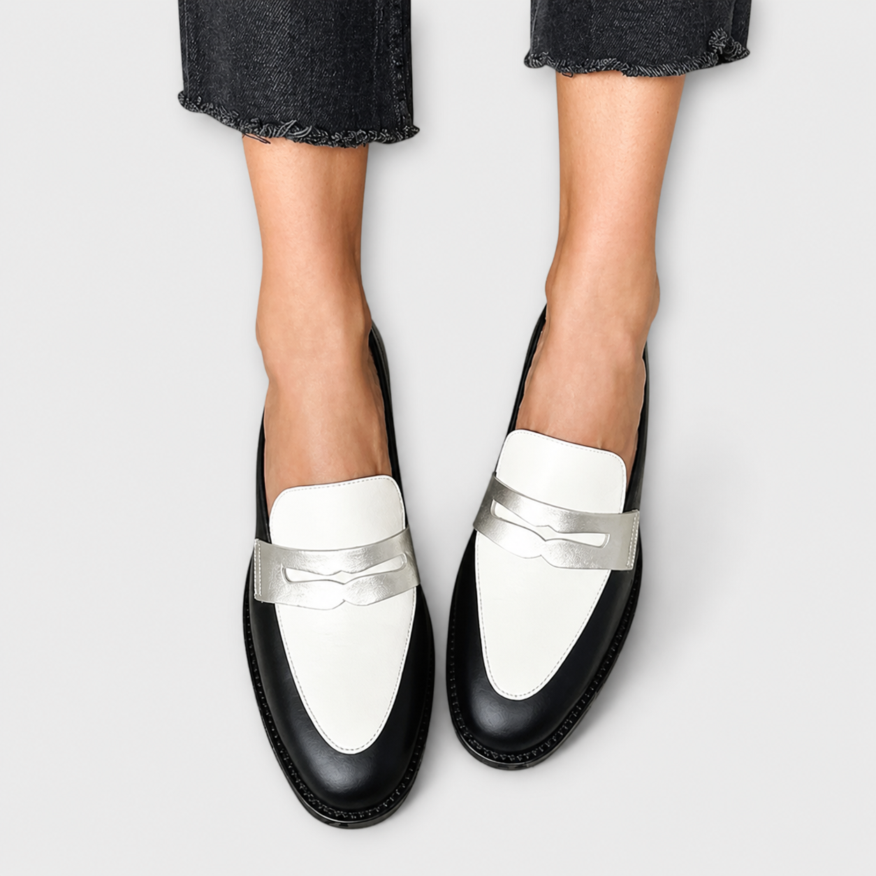 Black loafers with a subtle metallic sheen and refined detailing